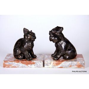 A pair of vintage spelter dog and cat book ends, mid 20th…