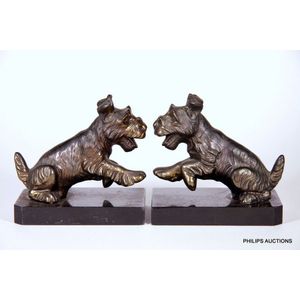 A pair of spelter terrier book ends, in bronzed spelter and…