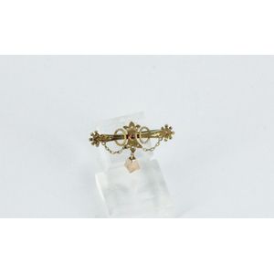 A Victorian bar brooch, 9ct rose gold, with red stones setting,…