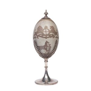 A silver plated emu egg ornament carved with horses and English…