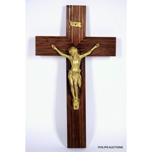 A cast ormolu and rosewood crucifix, of typical form, the…