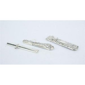 Three sterling silver needle cases, plain and foliate design.…
