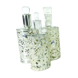 Three late Victorian silver covered glass perfume bottles, the&hellip;