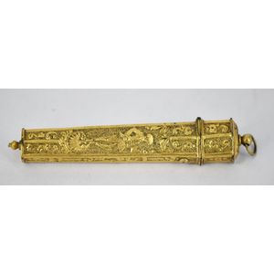 A needle case, the gilt body depicting an Italian character.…