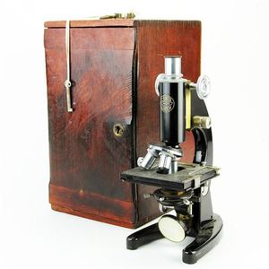 London C. Baker microscope supported by a horseshoe base. the…