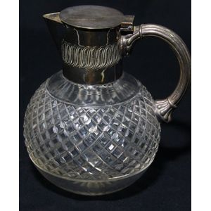 A cut crystal decanter with claret jug with silver plate mount,…