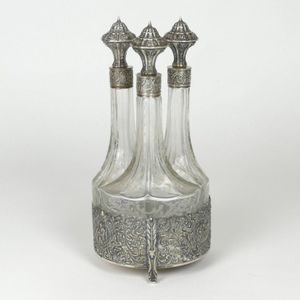 An early 20th century Dutch silver decanter set, the stand…