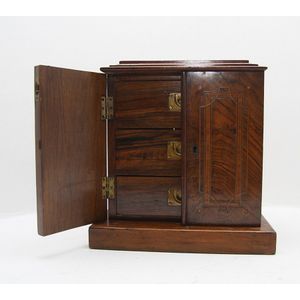 An interesting French apprentice cabinet in walnut fitted with…
