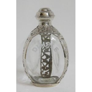 A silver mounted triangular glass dimple decanter, 22 cm high