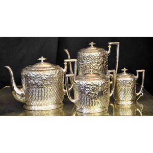 A four piece floral embossed silver plated tea and coffee…