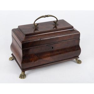 A Georgian bombe shaped tea caddy, flame mahogany with brass…