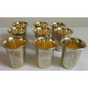 Nine antique Russian silver gilt vodka beakers all part of a…