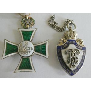 Two Russian Imperial silver and enamel badges comprising a red,…