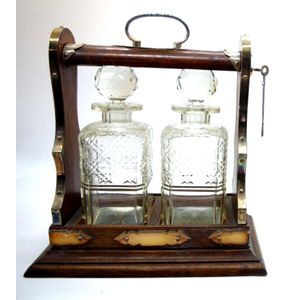 Oak 2 decanter tantalus, with silver plated fittings and key…