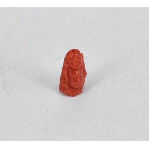 Carved coral, shaped as a Buddha. Height 1 cm. Weight 1.4g.