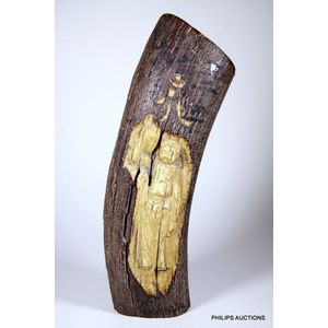 A significant Petrified Mammoth tusk with antique Oriental…