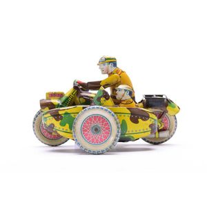 A tin motorcycle with sidecar wind-up toy with two Japanese…