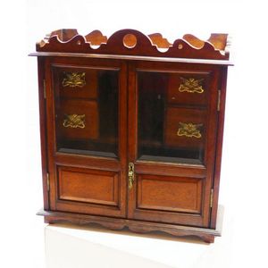 An Edwardian apothecary cabinet oak construction. Double glazed…