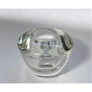 A large Kosta Boda glass candle holder, signature to base,…