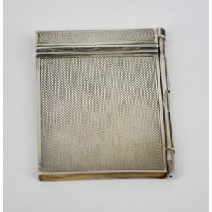 An Art Deco sterling silver dance notebook, with engine turned…