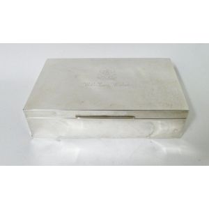 A silver cigar box, plain rectangular shape, the hinged lid…