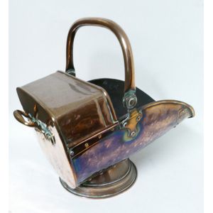 A Victorian copper coal scuttle, swing handle and studded…