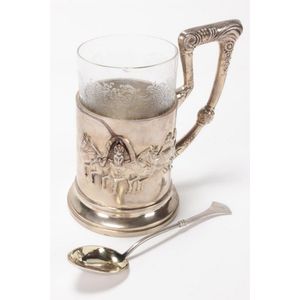 Good Russian silver tea cup holder and cup, set with an angled…