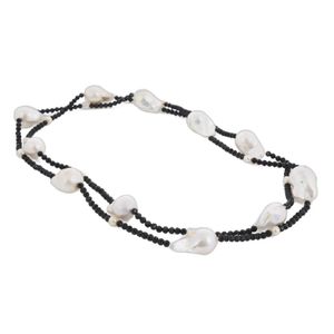 Infinity strand of pearl and onyx. Featuring eleven large…
