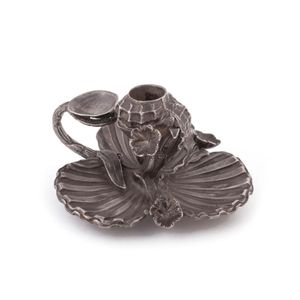 A vintage English sterling silver candle holder with shell…
