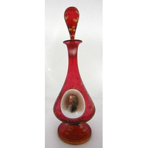 A Bohemian ruby glass decanter having a painted panel. 26 cm…