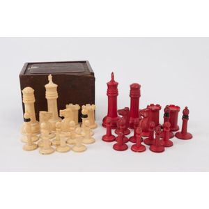 An antique whalebone chess set in wooden box with Chinese…