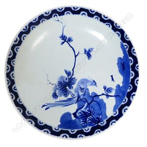 A large Japanese Arita blue and white charger, decorated with…