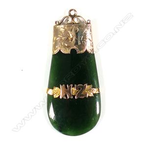 A colonial pounamu and 9ct gold pendant, engraved cap mount and…