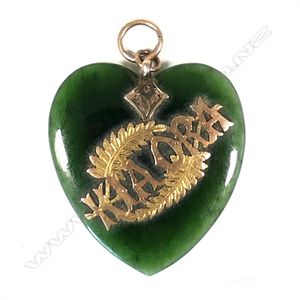 A colonial pounamu and 9ct gold heart pendant, 'Kia Ora' and…