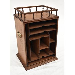 A petite wooden desk tidy with a Galleried top and brass…