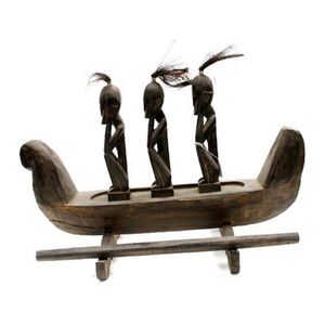 A Dyak canoe, with three Dyak figures in squatting form on&hellip;