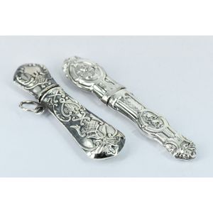 Two sterling silver needle cases, of various design. Length 6…