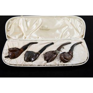 Cased set of four antique wooden pipes walnut and briar the…