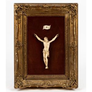 Christ carved ivory figure mounted on velvet board in gilt…