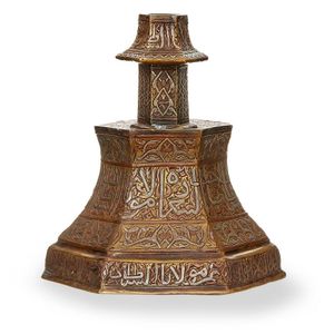 A copper and silver inlaid hexagonal brass Mosque candlestick,…