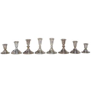 Four pairs of American sterling silver candle stands weighted…
