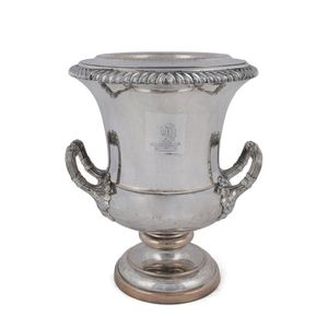 An antique English champagne ice bucket with armorial crest,…