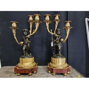 A pair of world class French bronze candelabras. Each having a…