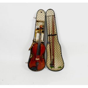 An antique cased violin, with two piece back, with three…