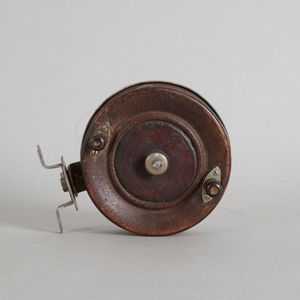 A vintage wood and steel fly reel, unnamed, width 10 cm, depth…