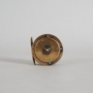 An a & W McCarthy fly reel, made from brass. Branded 'A & W Mc…