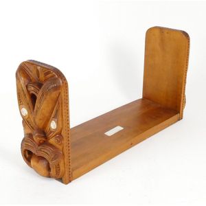 A New Zealand timber Maori carved bookends, the fixed base…
