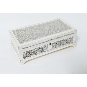 A small ivory casket, the hinged lid and walls finely pierced…