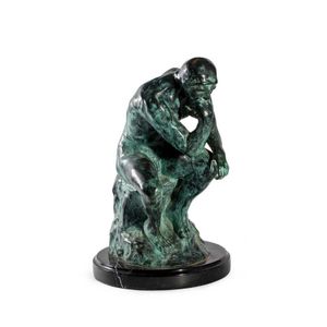 A bronze figure of Rodin's, The Thinker, on black marble base,…
