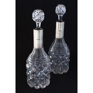 Pair of English sterling silver and crystal decanters and…